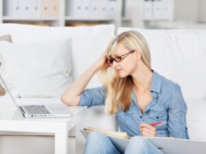 A woman deep in study, illustrating the importance of continuous learning and self-assessment in developing expertise.